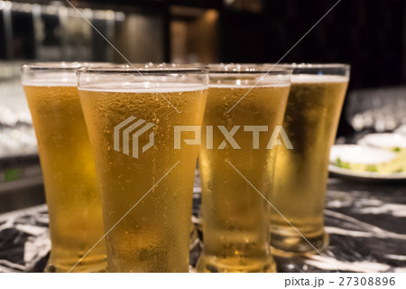 Glass of beer served on the counter in a party 27308896