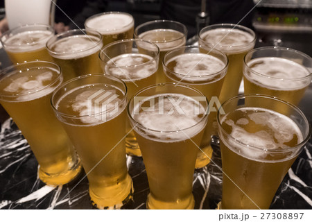 Glass of beer served on the counter in a party 27308897