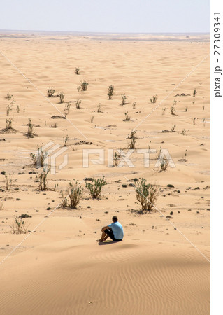 Man desert rub al khali Oman sit sand landscape Man desert rub al khali Oman sit sand landscape 27309341