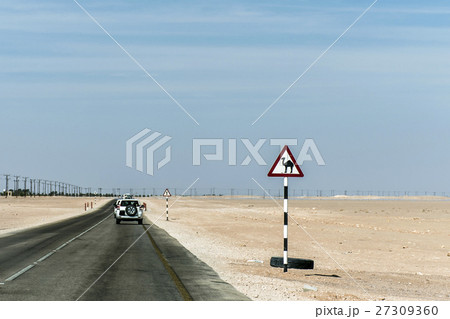 Camel warning sign desert street road dhofar Oman Camel warning sign desert street road dhofar Oman 27309360