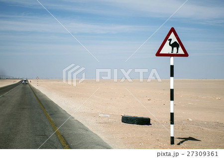 Camel warning sign desert street road dhofar Oman Camel warning sign desert street road dhofar Oman 27309361