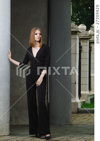 Red hair fashion model in black overall posing Red hair fashion model in black overall posing 27309929