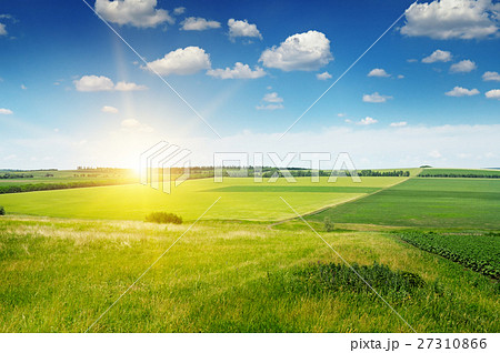 hilly terrain, field and sunrise on blue sky hilly terrain, field and sunrise on blue sky 27310866