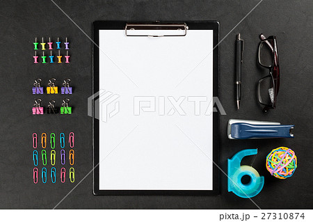 Black clipboard on a table 27310874