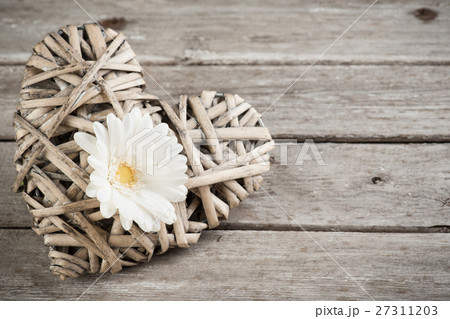 white flower and wicker decorative heart white flower and wicker decorative heart 27311203