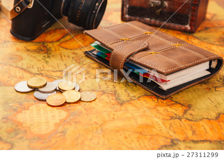 notebook, camera on the background of vintage map 27311299