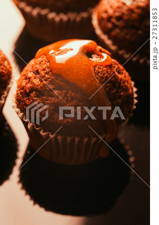 Sweet homemade chocolate muffin with caramel Sweet homemade chocolate muffin with caramel 27311853