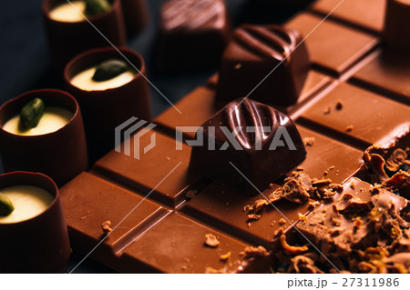 Many chocolate sweets Pistachio black background  27311986
