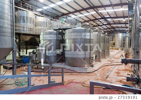 Stainless cisterns with fermenting wine in fabric Stainless cisterns with fermenting wine in fabric 27319191