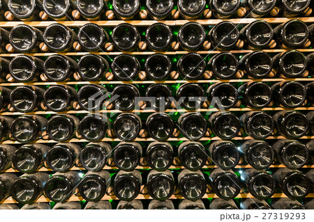 Racks with bottled wine in plant storage 27319293