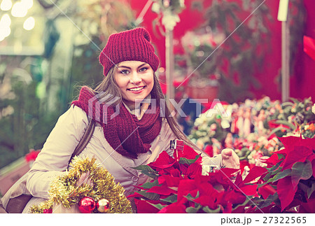 female customer choosing decorations female customer choosing decorations 27322565