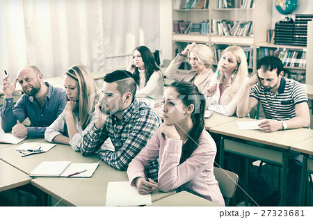 Bored students sitting at lesson Bored students sitting at lesson 27323681