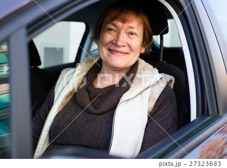 Portrait of female senior driver in car Portrait of female senior driver in car 27323683