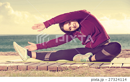 girl exercising on exercise mat outdoor 27324114