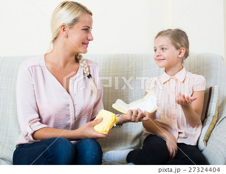 Mother with daughter discussing menstruation and sanitary products Mother with daughter discussing menstruation and sanitary products 27324404
