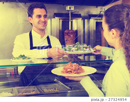 Girl buying kebab and salad 27324954