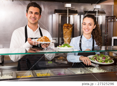 Portrait of happy workers with kebab 27325296