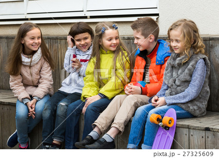 Junior kids chatting outdoor . Junior kids chatting outdoor . 27325609