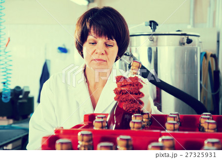 Glad female employee packing wine bottles Glad female employee packing wine bottles 27325931