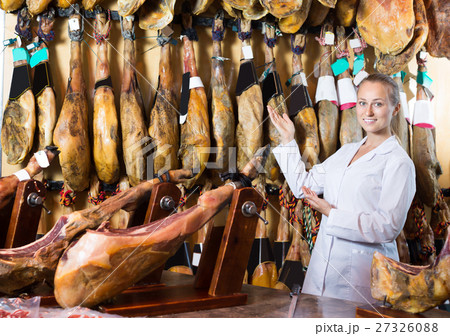 Portrait of happy woman selling prosciutto meat Portrait of happy woman selling prosciutto meat 27326088