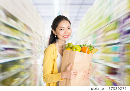 Buying groceries in supermarket 27329275