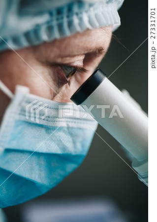 Close up view of scientist eye 27331701