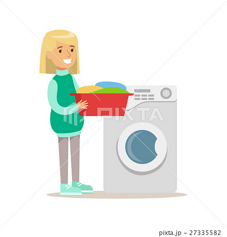 Girl Loading Washing Machine With Clothes Smiling 27335582