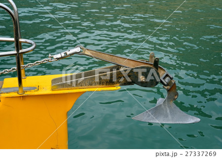 Metal anchor on the bow of the yacht 27337269