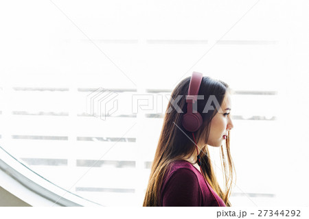 Young Woman Listening Music Concept Young Woman Listening Music Concept 27344292