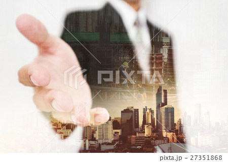 Businessman stretch hand,with buildings background 27351868