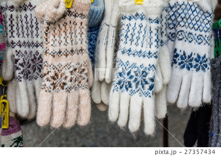 Bunch of handmade colorful woolen gloves Bunch of handmade colorful woolen gloves 27357434