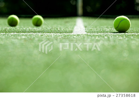 tennis balls on tennis grass court tennis balls on tennis grass court 27358618