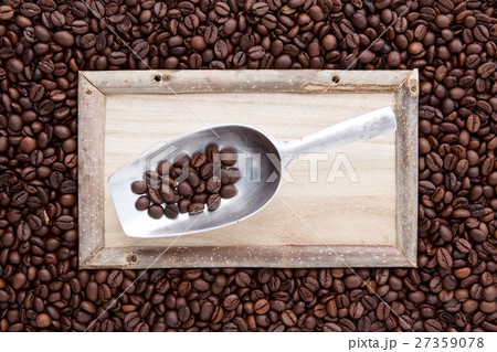 wood frame with scoop on top of flat lay of brown  27359078