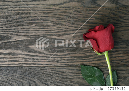 romantic background with red rose on wood table romantic background with red rose on wood table 27359152
