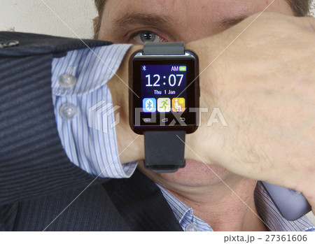 man looking at his watch. 27361606