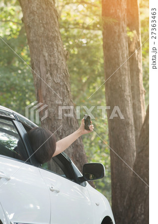 traveler woman taking photo from inside the car 27363463