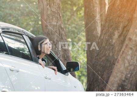 Asian traveler woman breathing fresh nature air 27363464