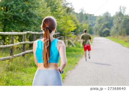 Couple running outdoors 27368640