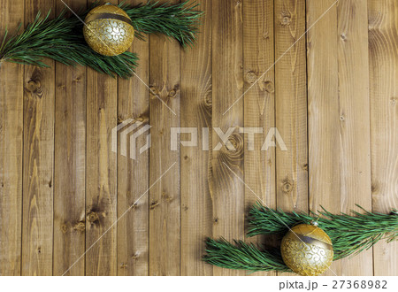 Christmas decored branches on wood background 27368982