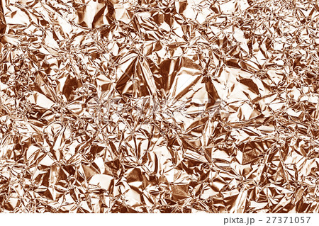 Shiny foil texture for background.Rose gold color. Shiny foil texture for background.Rose gold color. 27371057