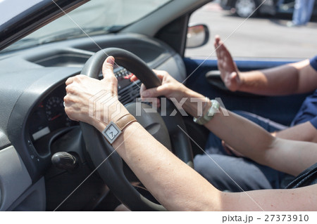 Senior learning to drive a car  27373910