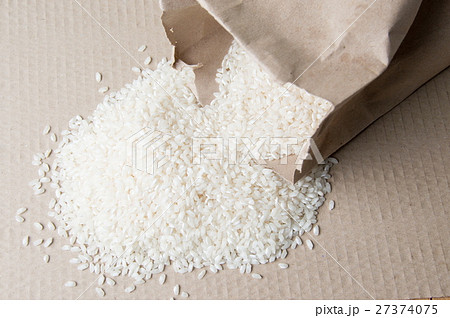 Rice falling out of paper bag Rice falling out of paper bag 27374075
