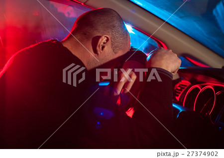 Drunk Man covering his face from police car light Drunk Man covering his face from police car light 27374902