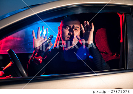 Man with beer bottle in car surrendering to police Man with beer bottle in car surrendering to police 27375078