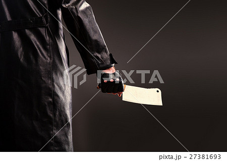 Killer holding meat cleaver in hand. 27381693