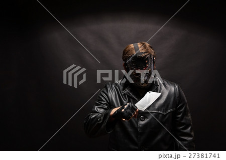Bloody murderer in hockey mask with meat cleaver Bloody murderer in hockey mask with meat cleaver 27381741