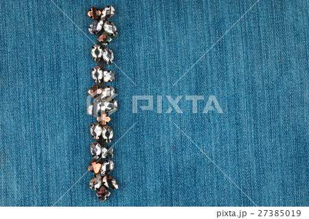 Fashionable background, denim in rhinestones. 27385019