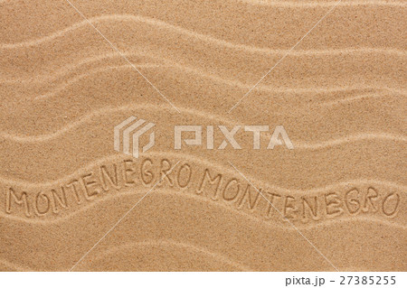 Montenegro inscription on the wavy sand 27385255
