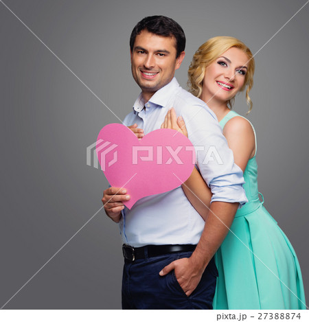 Beautiful couple holding pink heart 27388874