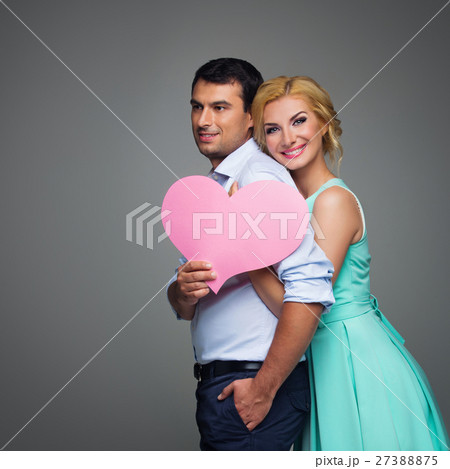 Beautiful couple holding pink heart 27388875